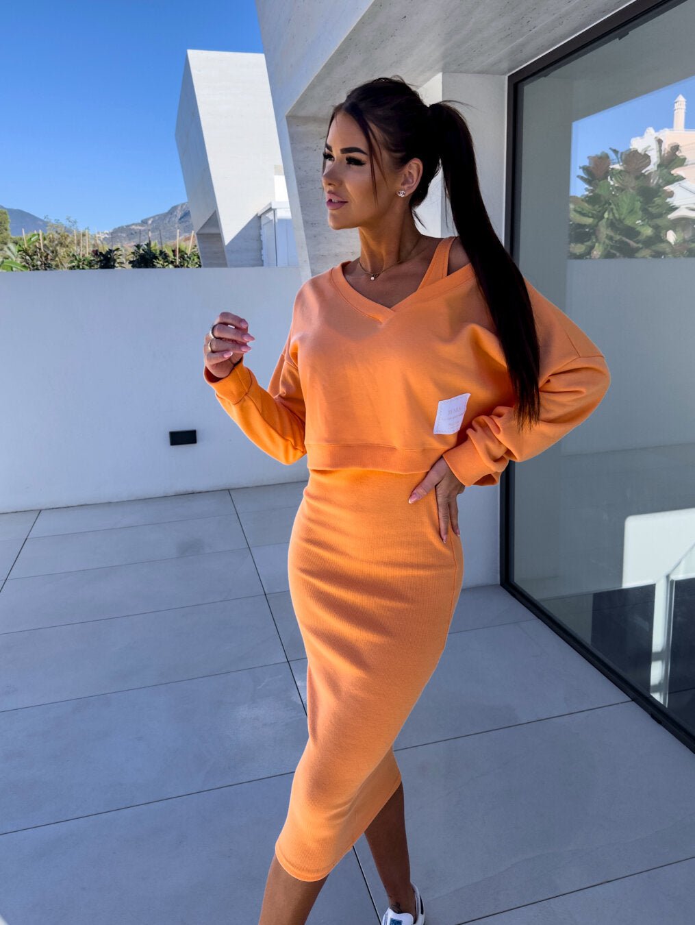 Chic two-piece set featuring a stylish midi dress paired with a comfortable sweatshirt, perfect for versatile women's fashion. 0